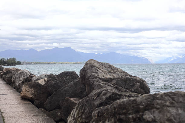Promenade bordered by a breakwater on a cloudy day by the lakeshore