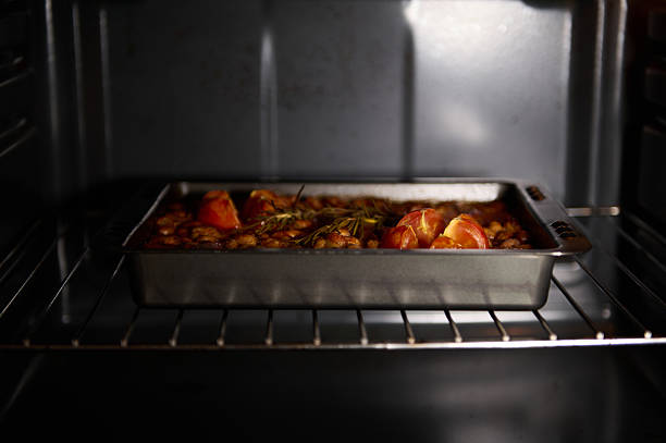 istock Roasted Dish with Tomatoes and Beans in an Oven Ready to Serve 2211645249