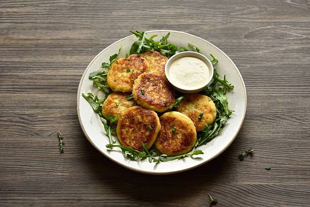 istock Potato pancakes made from mashed potato and green onion served with dipping sauce 2211645328
