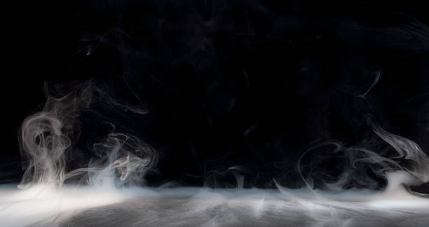 istock Mysterious swirling smoke rising against a dark backdrop in an atmospheric setting 2211648431