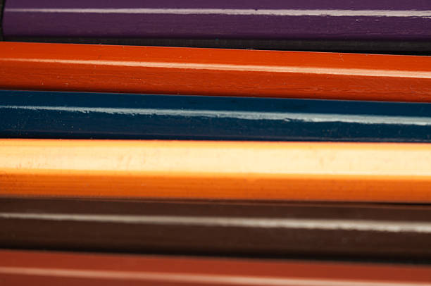 istock Colorful pencils are arranged in a row, ready for creative projects 2211648633