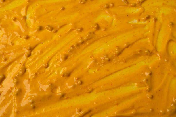 istock Yellow sauce splashes as a background. 2211648942