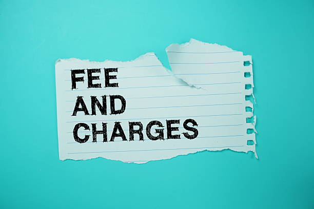 istock Fee And Charges text written on paper flat lay on blue background 2211650072