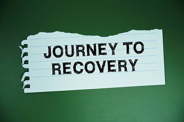 istock Journey To Recoverytext written on paper flat lay on green background 2211650146