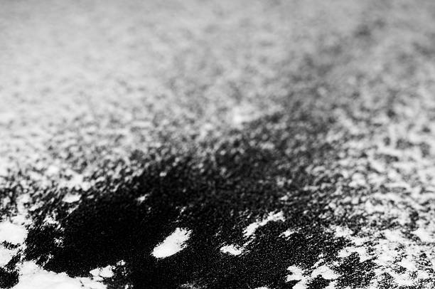 istock White powder spills onto a dark surface 2211650453