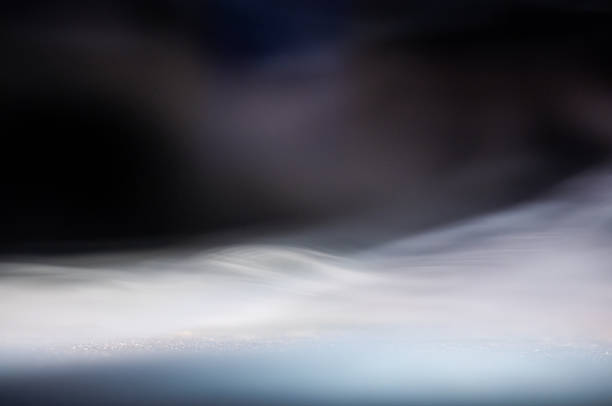 Soft smoke trails dance elegantly in dim lighting, creating a serene atmosphere.