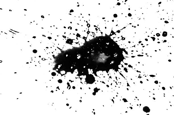 Bold black ink spreads outward, creating striking patterns against a white backdrop.