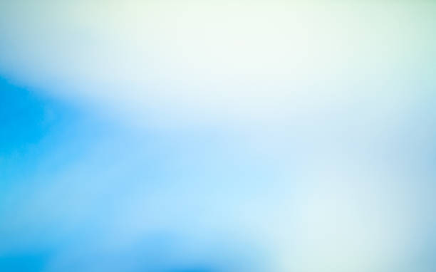 istock Bright blue sky with soft white clouds on a sunny day over an open landscape 2211651215