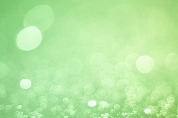 Gentle green bokeh lights form a soothing backdrop with a dreamlike quality.