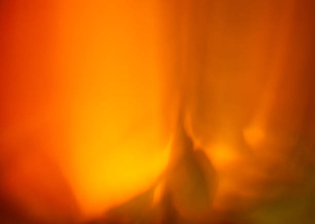 istock Bright orange flames dance in a fireplace during a cozy evening gathering 2211652213