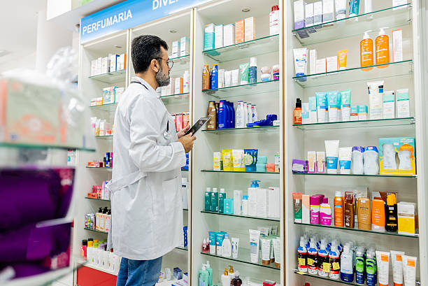 istock Mature pharmacist working using a digital tablet at the drugstore 2211653104