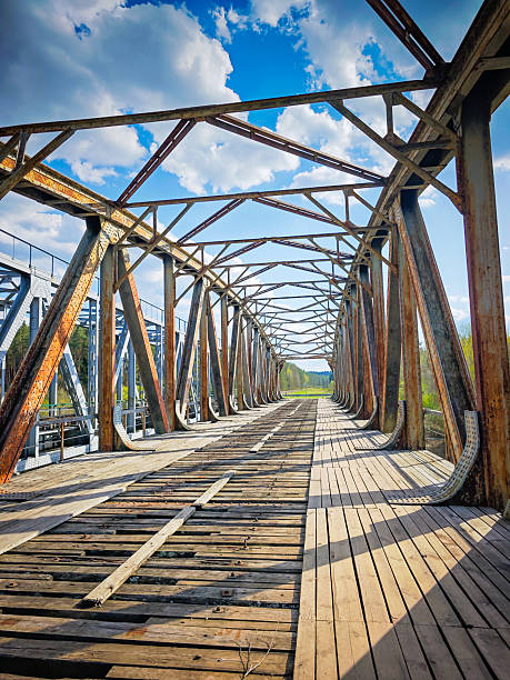 istock Abandoned metal railway bridge structure. Old metal railroad bridge in Lithuania 2211656251