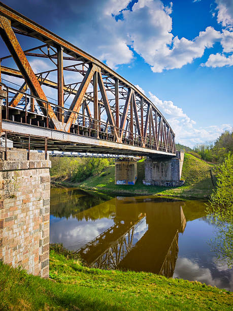 istock Abandoned metal railway bridge structure. Old metal railroad bridge in Lithuania 2211656252