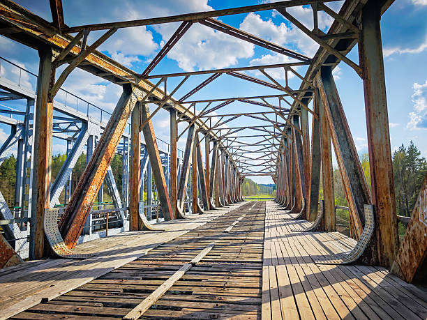 istock Abandoned metal railway bridge structure. Old metal railroad bridge in Lithuania 2211656374