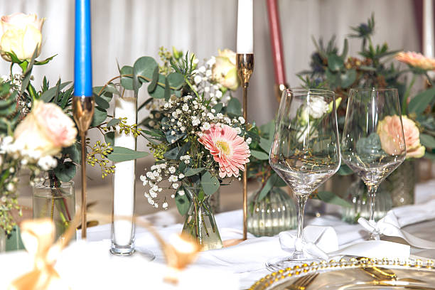 istock Elegant wedding table setting with floral arrangements and glassware 2211658130