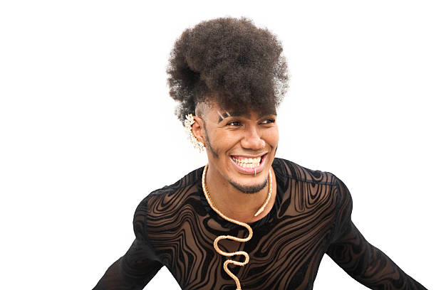 istock Young androgynous man with afro hair smiling and looking away 2211658794