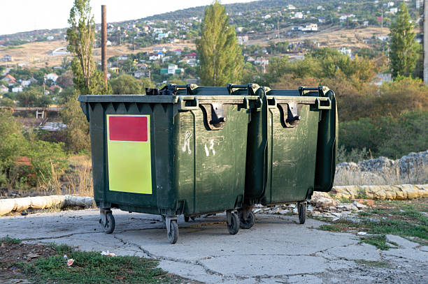 istock Waste Containers Positioned Against an Urban Landscape 2211661869