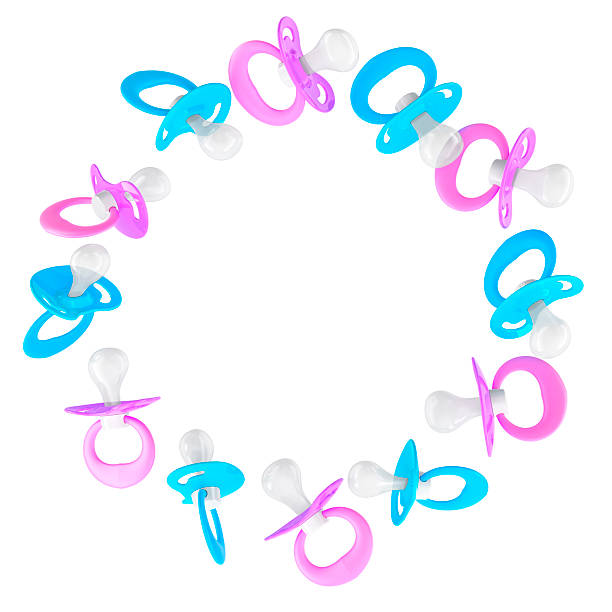 istock Frame from baby pacifiers. Blue and pink colors, round. 3D rendering 2211662534