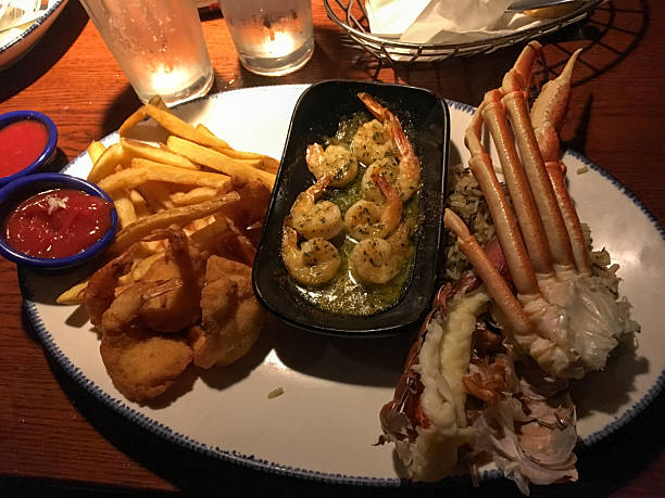 istock Seafood Platter with fries and sauce on table 2211663668