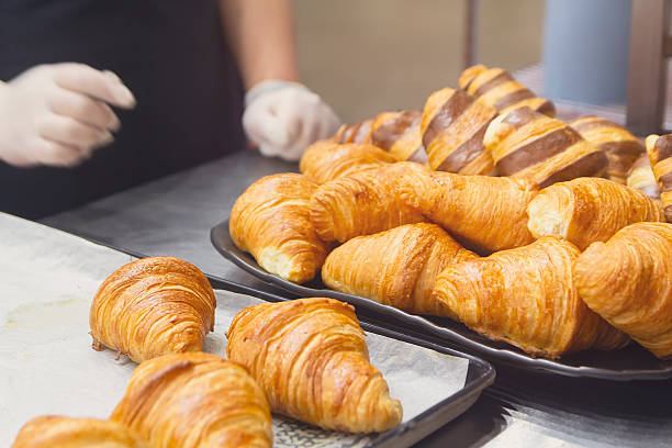 istock Fresh croissants on counter at bakery 2211664045