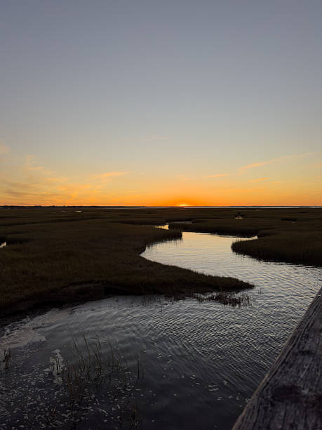 istock Sunset Over the Bay with Marsh Grass 2211664907