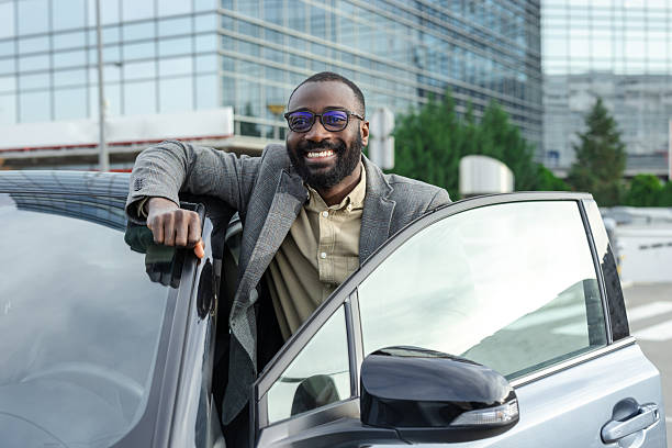 istock Car owner in modern urban environment 2211668023
