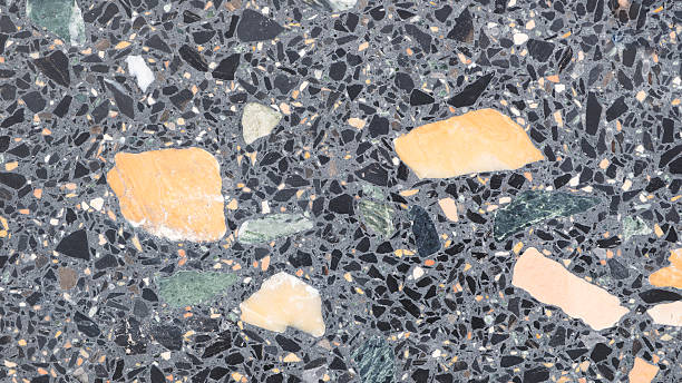 istock Abstract textured stone background with a pattern of small particles interspersed 2211668951