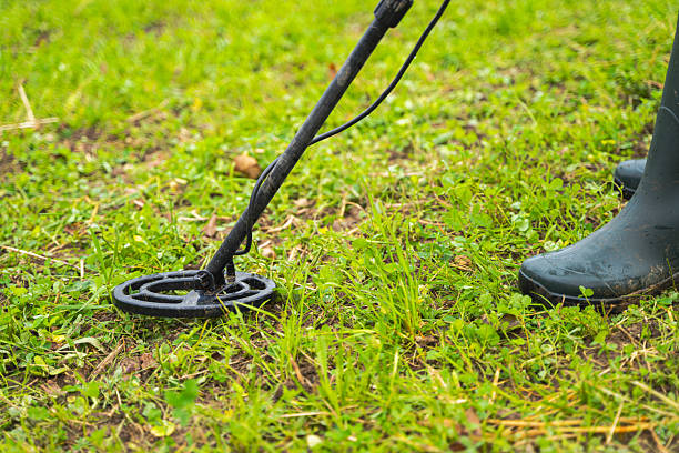istock Metal Detecting in a Grassy Field 2211669365