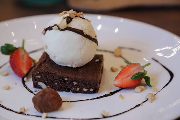istock Ice cream on brownie with chocolate sauce 2211672646