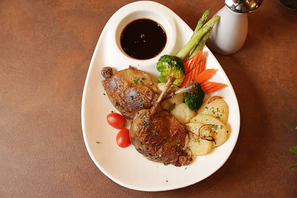 istock Quail steak on a plate with sauce and vegetables 2211672650