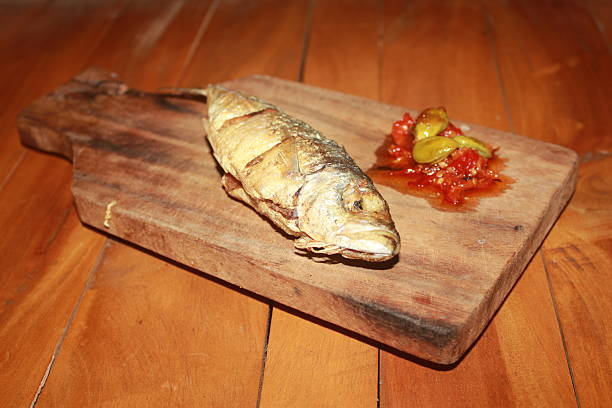 istock fried fish with traditional sambal 2211674299