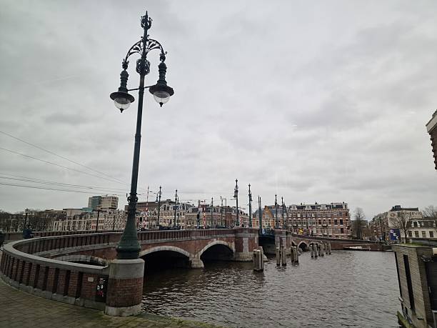 istock Canal bridge in Amsterdam, Netherlands 2211674532
