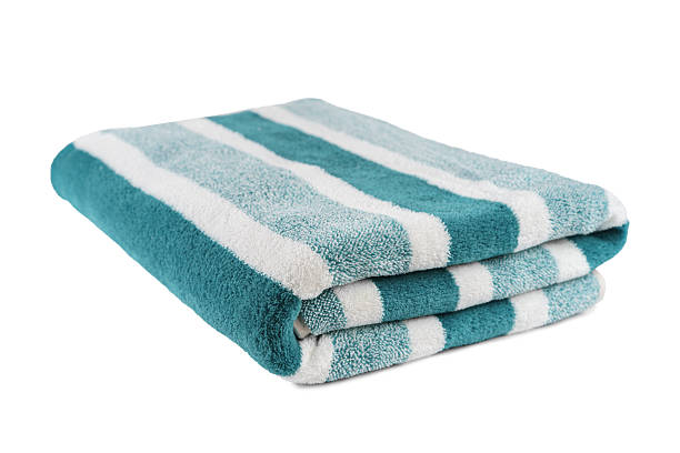 istock Carefully folded soft striped bath turquoise towel isolated on white background 2211675197