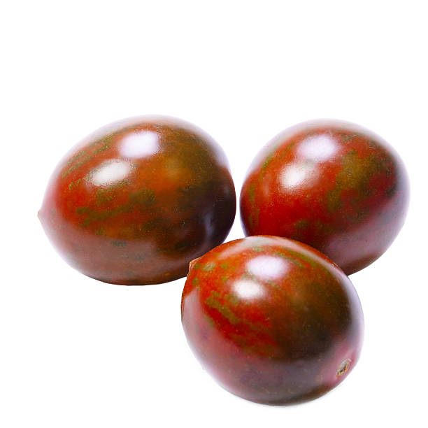 Cherry tomatoes "Chocolate sprinkles" variety on white background.