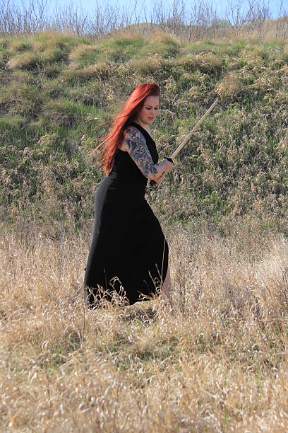 istock The Strong CJ Practices Her Sword by the River. 2211686624