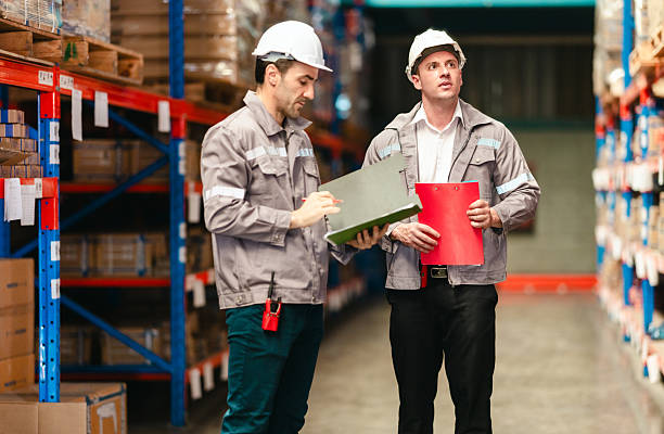 istock Warehouse staff count inventory for precise stock levels, timely orders, and efficient operation. 2211686637