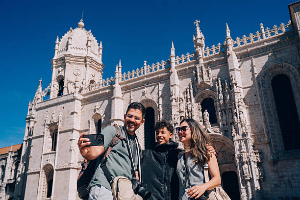 istock Family taking a selfie in front of Mosteiro dos Jeronimos 2211688830