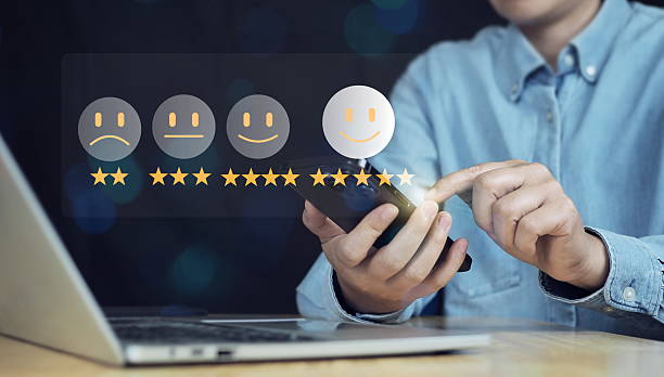 istock Customer satisfaction survey concept, Businessman using smartphone touch happy smiley icon, 5 star service experience rating, Feedback, Online review 2211695489