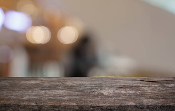 istock Empty wood table top and blur of restaurant background selective focus product display 2211695873