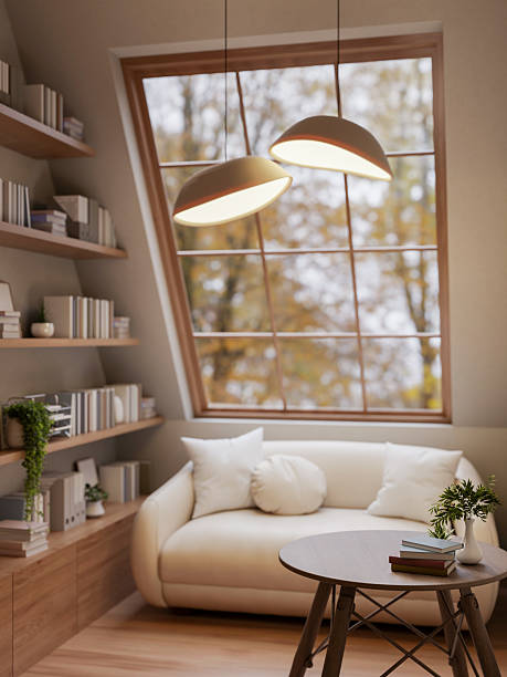 istock Wooden stool table and white sofa under lamp light inside attic room with bookshelf and roof window. 2211697865
