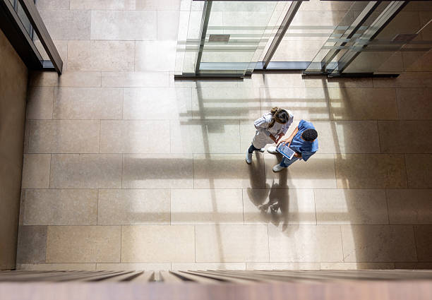 istock Healthcare workers looking at test results on a digital tablet 2211699191