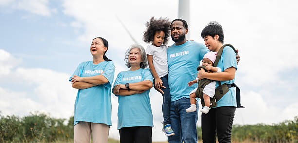 istock group of people wearing blue shirts with the word donate on them 2211702375