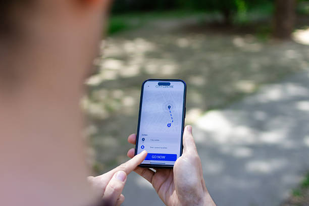 istock Tourist using navigation app on smartphone to find city center 2211704733