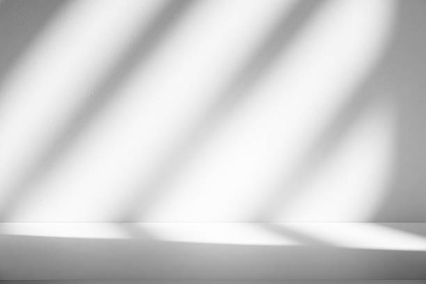 istock Wall interior background, studio and backdrops show products.with shadow from window color white . background for text insertion and presentation product 2211707540