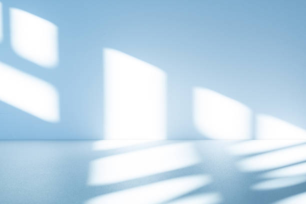 istock Studio style background wall decoration presentation uses white and blue tones. with shadows cast from a nearby window, concept creating a decorative 2211707550
