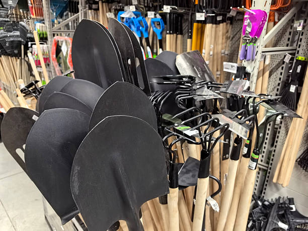 istock Garden tools lined up for selection in a bright retail store space 2211708977