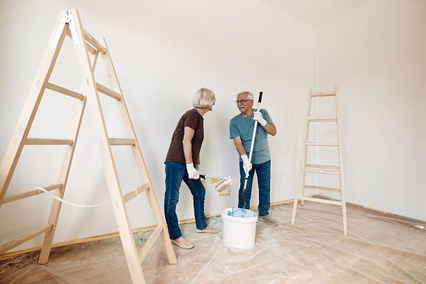 istock Happy mature couple talking while renovating their new apartment. 2211709604