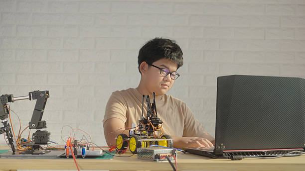 istock Asian teen coding robotic car at home, STEM education and home learning 2211710485