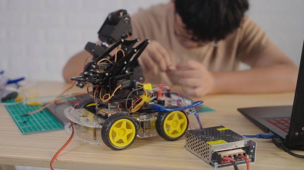istock Close-Up of Robotic Car with Arm in STEM Project 2211710518