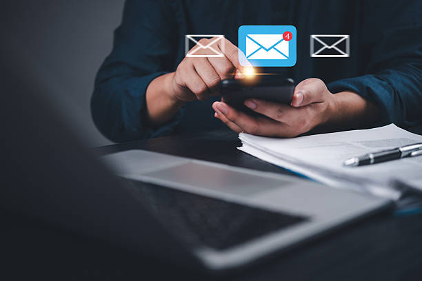 istock Man checking email alert pops up on smartphone with notification icon. Digital communication, mobile messaging and smart connectivity.Online contact, remote work 2211710847
